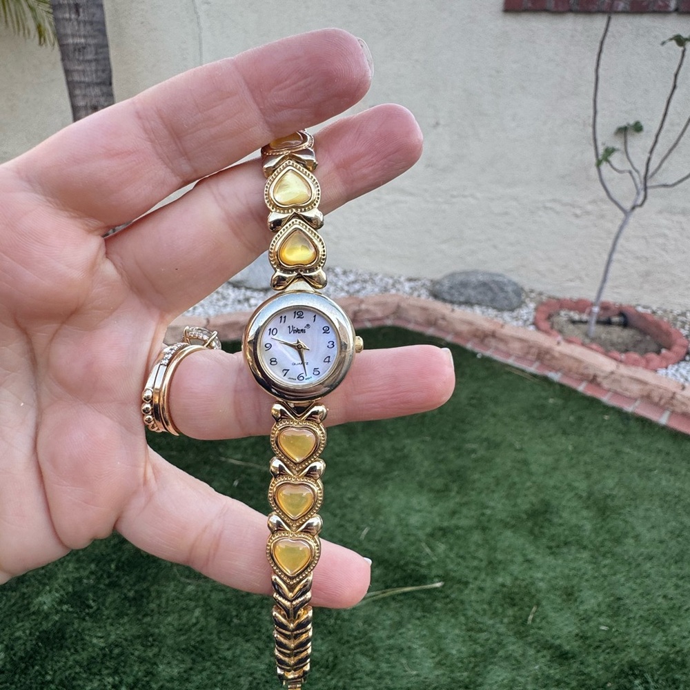 Vintage women’s gold and gemstones watch
